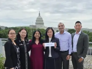 Group photo of AABANY members in front of the U.S. Capitol during NAPABA Lobby Day 2025, holding a sign labeled "New York"