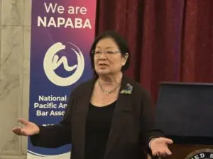 Senator Mazie Hirono speaking at the CAPAC reception beside a NAPABA banner during NAPABA Lobby Day 2025